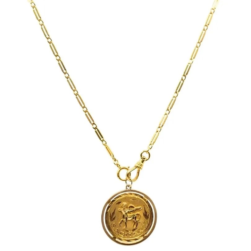 18K GOLD SAGITTARIUS ZODIAC PENDANT 10K GOLD WATCH CHAIN NECKLACE: DESIGNER: Unknown CIRCA: Late 20th Century MATERIALS: 10K Yellow Gold Chain, 18K Yellow Gold Pendant WEIGHT: 14.8 Grams MEASUREMENTS: The Length 14”; The Pendant Diameter - 1 3/16" HALLMARKS: 18
