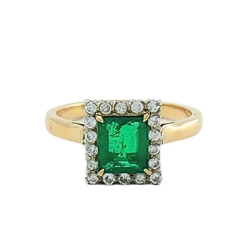 EMERALD RING VINTAGE 14K GOLD DIAMOND: EMERALD RING VINTAGE 14K GOLD DIAMOND Product details: DESIGNER: Unknown CIRCA: 1950’s MATERIALS: 14k Yellow Gold GEMSTONE: Emerald ,Round Brilliant Cut Diamond WEIGHT: 3.4 Grams RING SIZE: 7 HALLMA