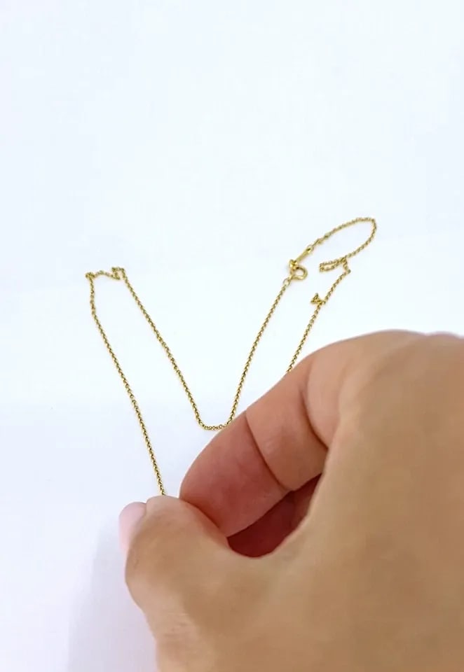 ELSA PERETTI TIFFANY & CO. 18K GOLD CALLA LILY PENDANT NECKLACE: ELSA PERETTI TIFFANY & CO. 18K GOLD CALLA LILY PENDANT NECKLACE DESIGNER: Elsa Peretti for Tiffany & Co. CIRCA: 1980s MATERIALS: 18k Gold WEIGHT: 5.3 Grams MEASUREMENTS: Chain - 17" Pendant - 7/16" x 