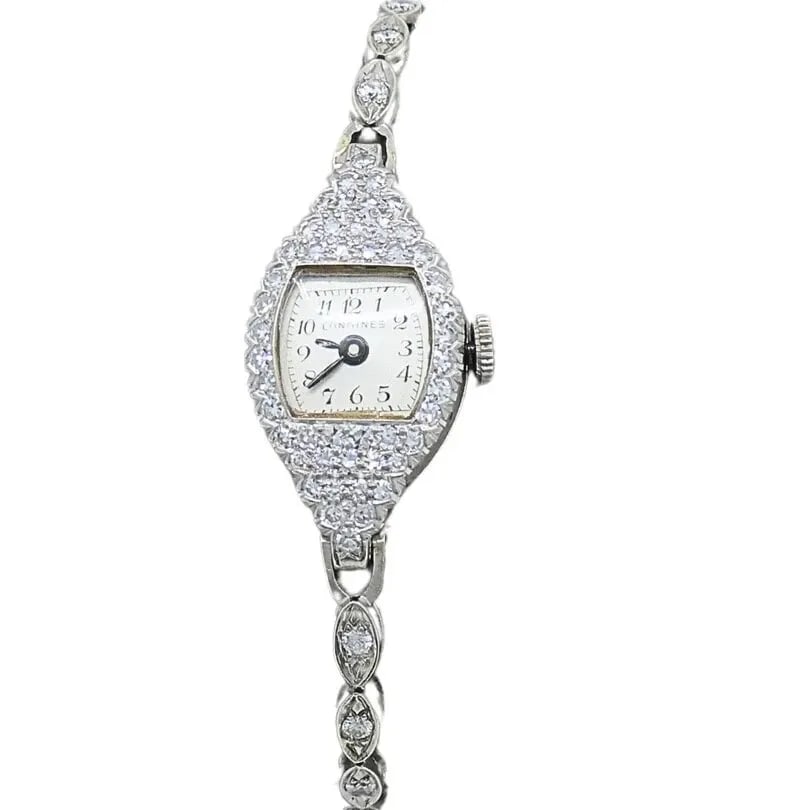 LONGINES WATCH ART DECO PLATINUM LADIES WATCH: LONGINES WATCH ART DECO PLATINUM LADIES WATCH Product details: DESIGNER: Longines CIRCA: 1920’s MATERIALS: Platinum GEMSTONE: Diamonds WEIGHT: 16.1 Grams MEASUREMENTS: 6" x 1/2" HALLMARKS: 10% irid 