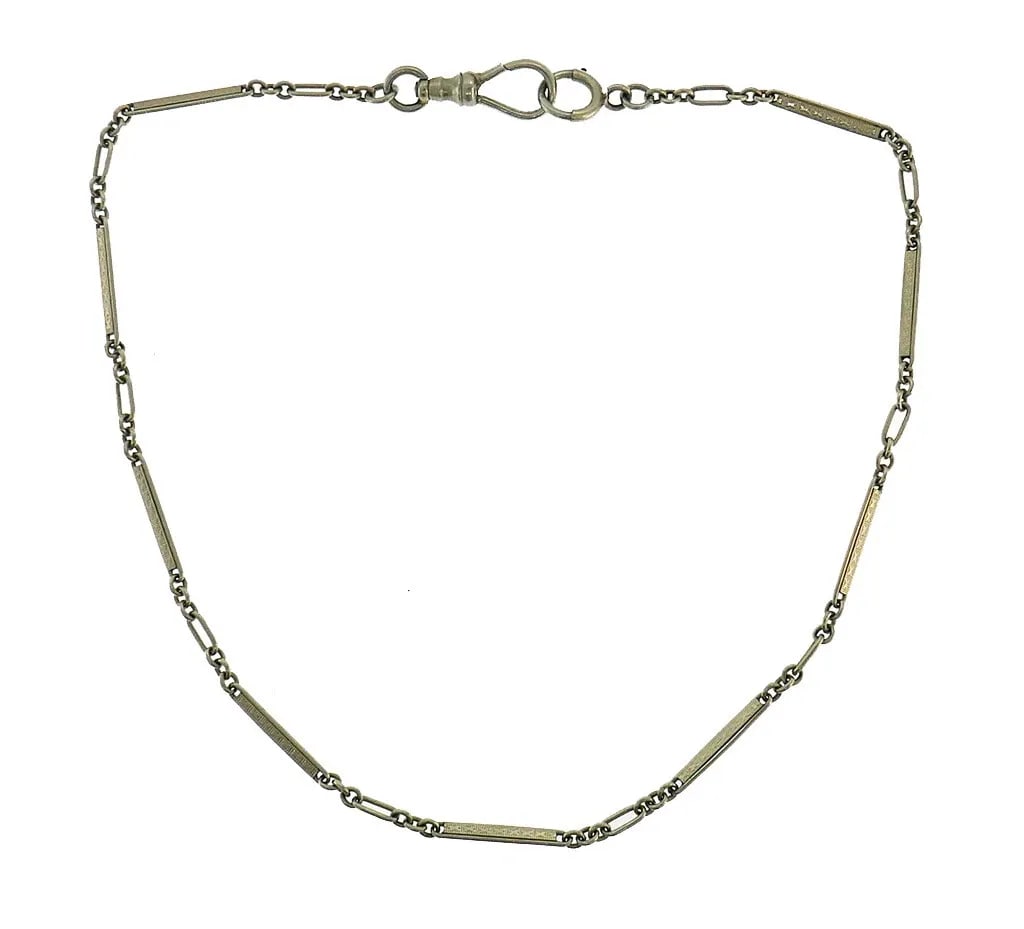 VICTORIAN GOLD WATCH CHAIN ANTIQUE: VICTORIAN GOLD WATCH CHAIN ANTIQUE Victorian White Gold Watch Chain Victorian watch chain created in the 1920s. Made of 14 karat (stamped) white gold. Measurements: 12-1/2 x 1/16 inches (32 x 0.2 cm).