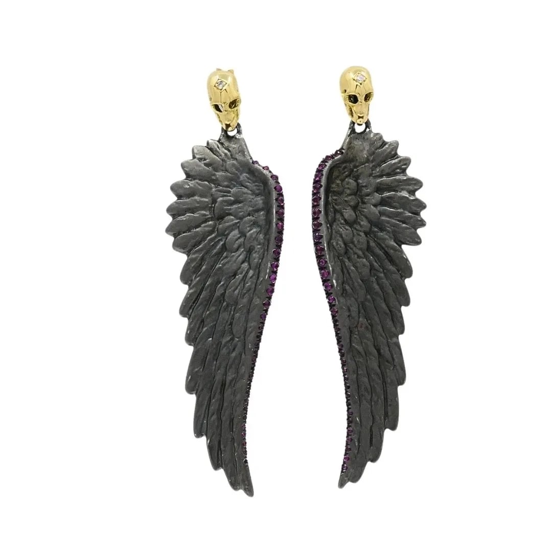THEODOROS 18K GOLD & STERLING SILVER RUBY WING SKULL EARRINGS: THEODOROS 18K GOLD & STERLING SILVER RUBY WING SKULL EARRINGS Designer Theodoros Materials 18k Gold, 925 Sterling Silver Gemstone Ruby, Diamond Weight 11.9 Grams Measurement 1/2" x 2 1/8" Hallmarks Th