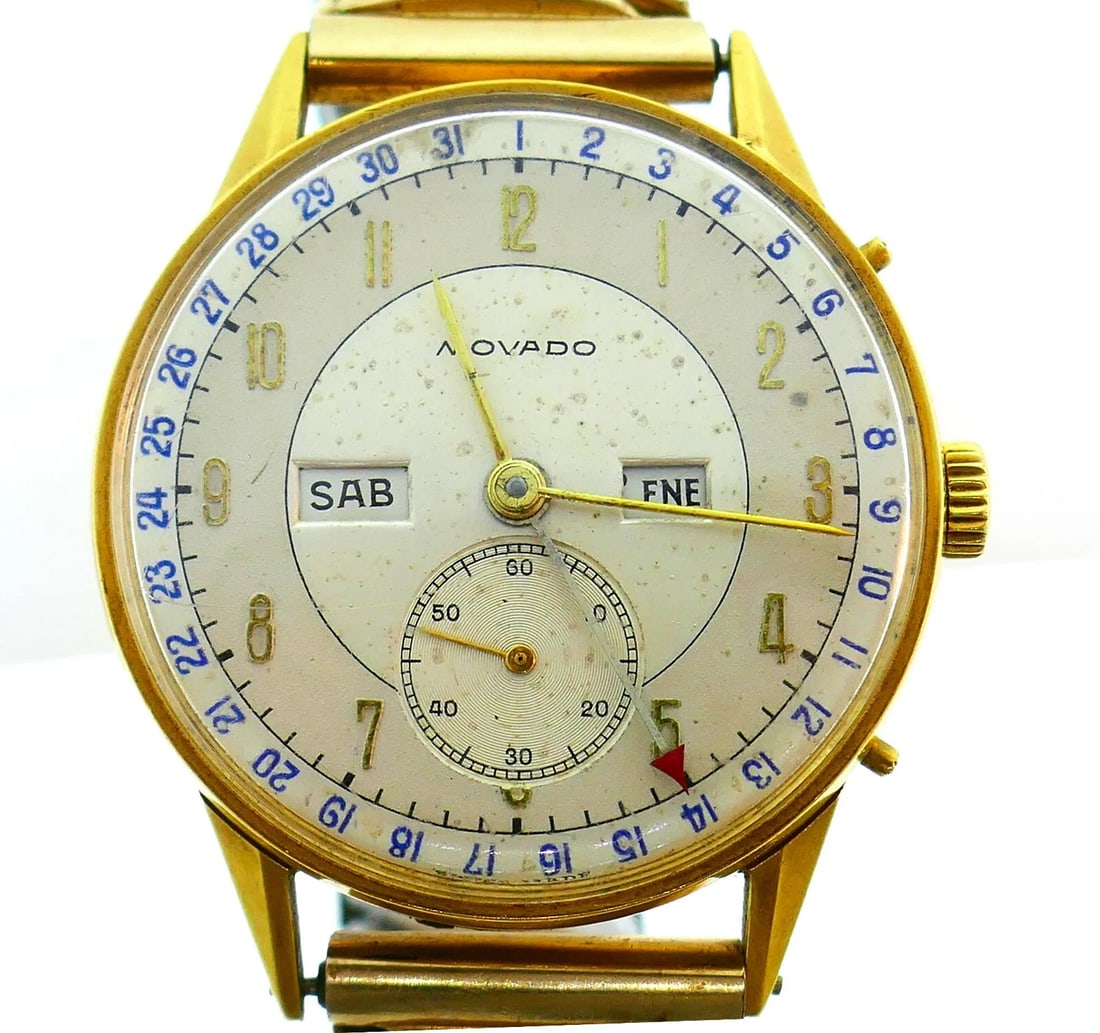 VINTAGE MOVADO GOLDPLATED UNISEX WATCH: VINTAGE MOVADO GOLDPLATED UNISEX WATCH Vintage MOVADO Gold-plated Unisex Watch Classic watch made of 10 karat gold-plated over stainless steel. Complications include: date, day, month, subsidiary seco