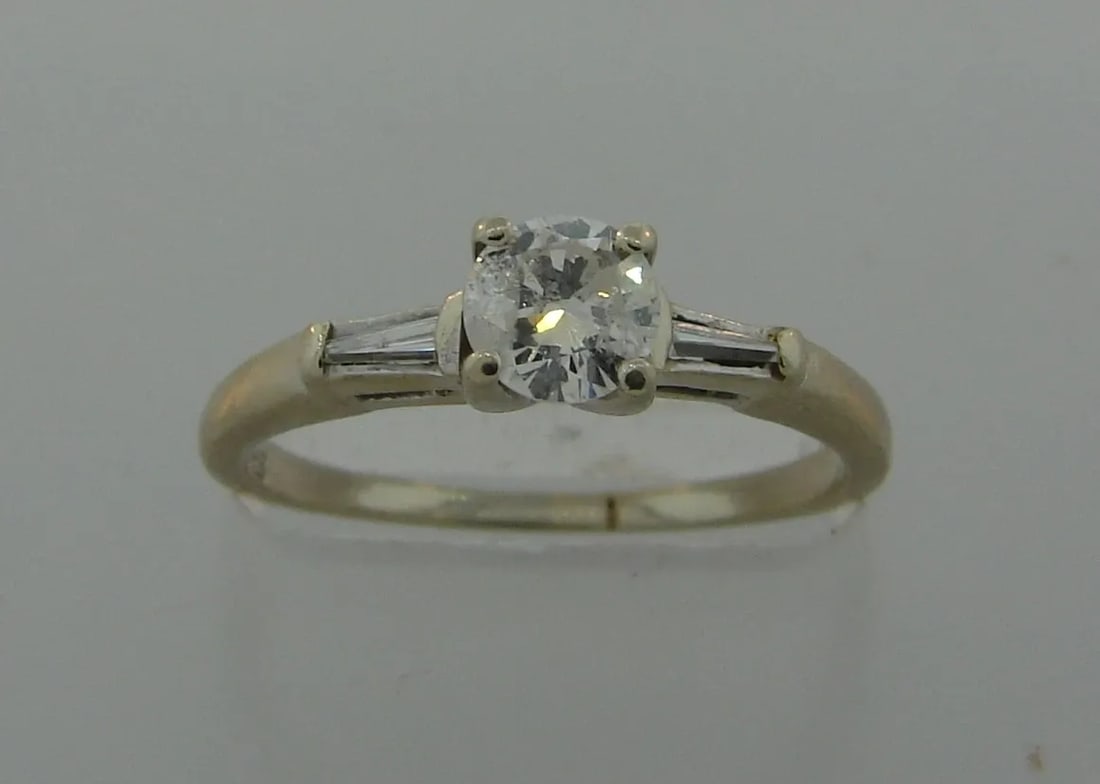 CLASSY DIAMOND WHITE GOLD SOLITAIRE RING ENGAGEMENT TIMELESS: CLASSY DIAMOND WHITE GOLD SOLITAIRE RING ENGAGEMENT TIMELESS Diamond & White Gold Ring Wonderful ring that is a great addition to your collection. Weight is 2.1 grams. Made of 14 karat (stamped) white