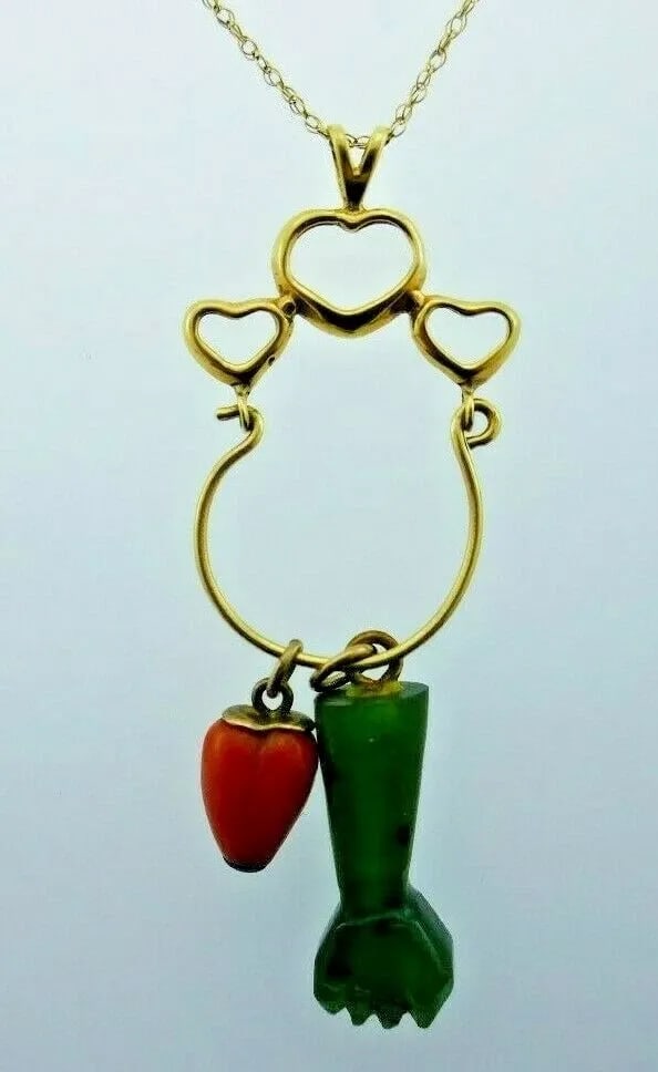 VINTAGE 14K YELLOW GOLD, CORAL & JADE FIGA & HEART MOTIF NECKLACE: VINTAGE 14K YELLOW GOLD, CORAL & JADE FIGA & HEART MOTIF NECKLACE 14k Yellow Gold, Coral & Jade Heart & Figa Motif Necklace This is a must for a collector. The weight is 6.6 grams. The length of chain