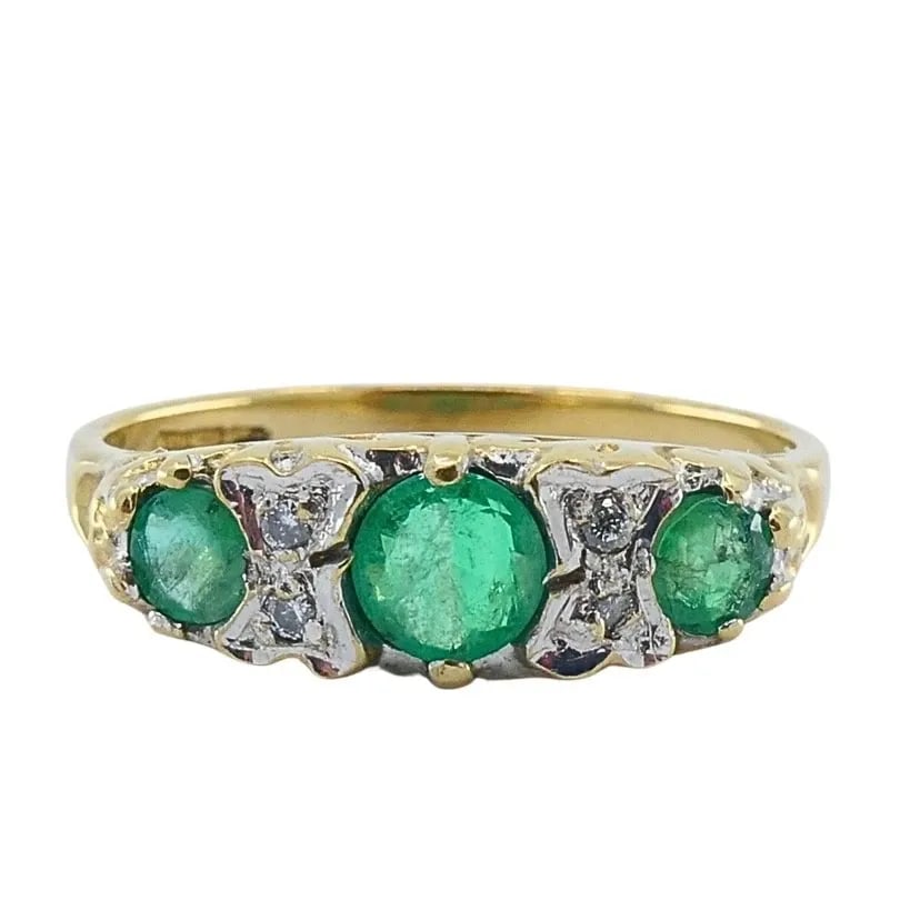 VINTAGE 9K GOLD EMERALD DIAMOND THREE-STONE RING: VINTAGE 9K GOLD EMERALD DIAMOND THREE-STONE RING Product details: MATERIALS: 9k Gold GEMSTONE: Emerald , Diamond WEIGHT: 1.8 Grams MEASUREMENTS: Top Width - 3/16" RING SIZE: 5.75 - 6 HALLMARKS: 375 IT