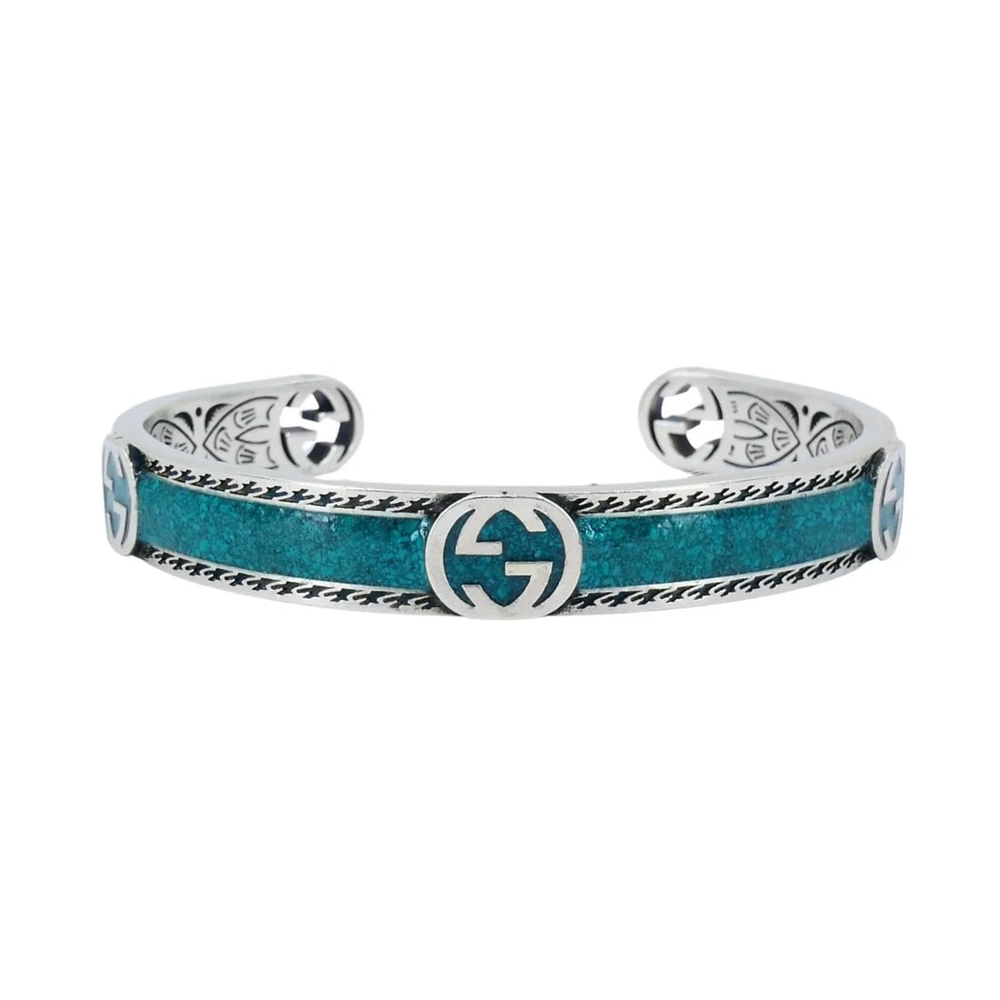 GUCCI STERLING SILVER ENAMEL INTERLOCKING G CUFF BRACELET: GUCCI STERLING SILVER ENAMEL INTERLOCKING G CUFF BRACELET KL AOO This Gucci sterling silver enamel cuff bracelet highlights the brand’s signature craftsmanship and bold design. The bracelet is craft