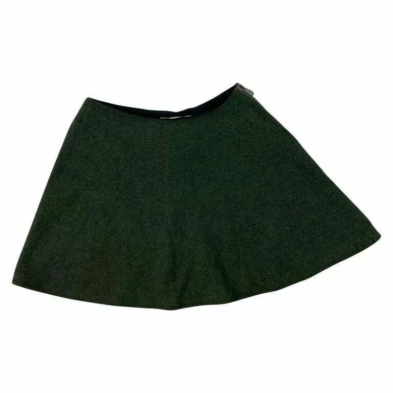 BALENCIAGA PARIS GREEN WOOL MINI SKIRT, SIZE 36: BALENCIAGA PARIS GREEN WOOL MINI SKIRT, SIZE 36 BALENCIAGA PARIS GREEN WOOL MINI SKIRT, SIZE 36 The skirt features flare style, mini length, full length grey side zip closure. Length: 15 in. (38.1 cm)