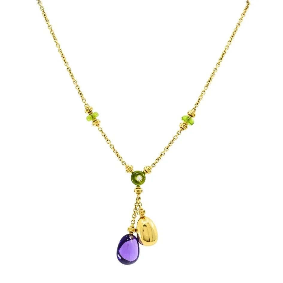 BVLGARI BULGARI 88 CLUB 18K GOLD AMETHYST PERIDOT NECKLACE: BVLGARI BULGARI 88 CLUB 18K GOLD AMETHYST PERIDOT NECKLACE DESIGNER: Bvlgari CIRCA: 1990s MATERIALS: 18k Gold GEMSTONE: Amethyst, Peridot WEIGHT: 32.8 Grams MEASUREMENTS: Chain - 16”, Pendant - 