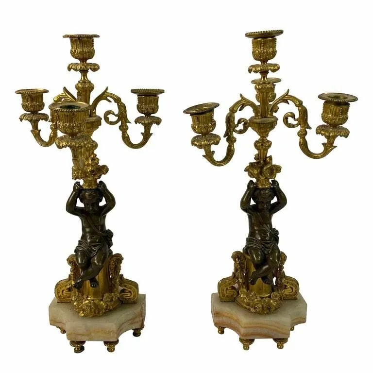 VICTORIAN BRONZE CHEROB PAIR OF CANDLESTICKS: VICTORIAN BRONZE CHEROB PAIR OF CANDLESTICKS VICTORIAN BRONZE CHEROB PAIR OF CANDLESTICKS The candlesticks are made out of bronze with onyx base and gold brass details, featuring carobs and floral, le