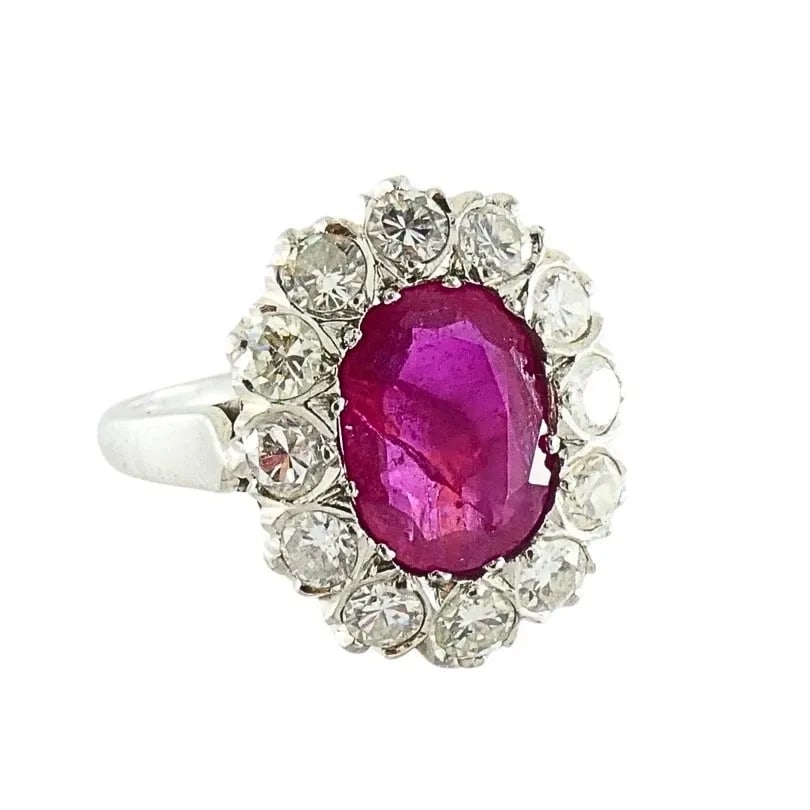 VINTAGE RUBY DIAMOND CLUSTER RING 14K GOLD: VINTAGE RUBY DIAMOND CLUSTER RING 14K GOLD Product details: MATERIALS: 14k Gold GEMSTONE: Diamond & Ruby WEIGHT: 5 Grams MEASUREMENTS: 1/2" x 5/8" Central Stone - 1/4" x 3/8" RING SIZE: 6 ITEM DETAILS