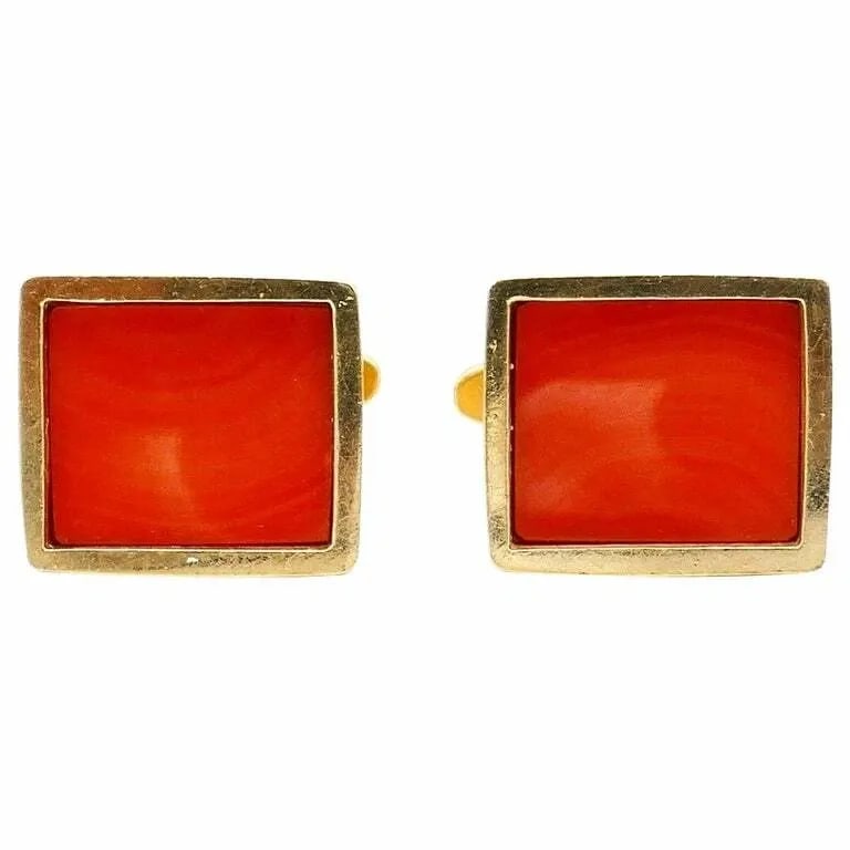 VINTAGE YELLOW GOLD CORAL RECTANGULAR CUFFLINKS: VINTAGE YELLOW GOLD CORAL RECTANGULAR CUFFLINKS Vintage Yellow Gold Coral Rectangular Cufflinks C. 1970s rectangular unisex cufflinks made of 14k yellow gold features polished coral. Stamped with a ha