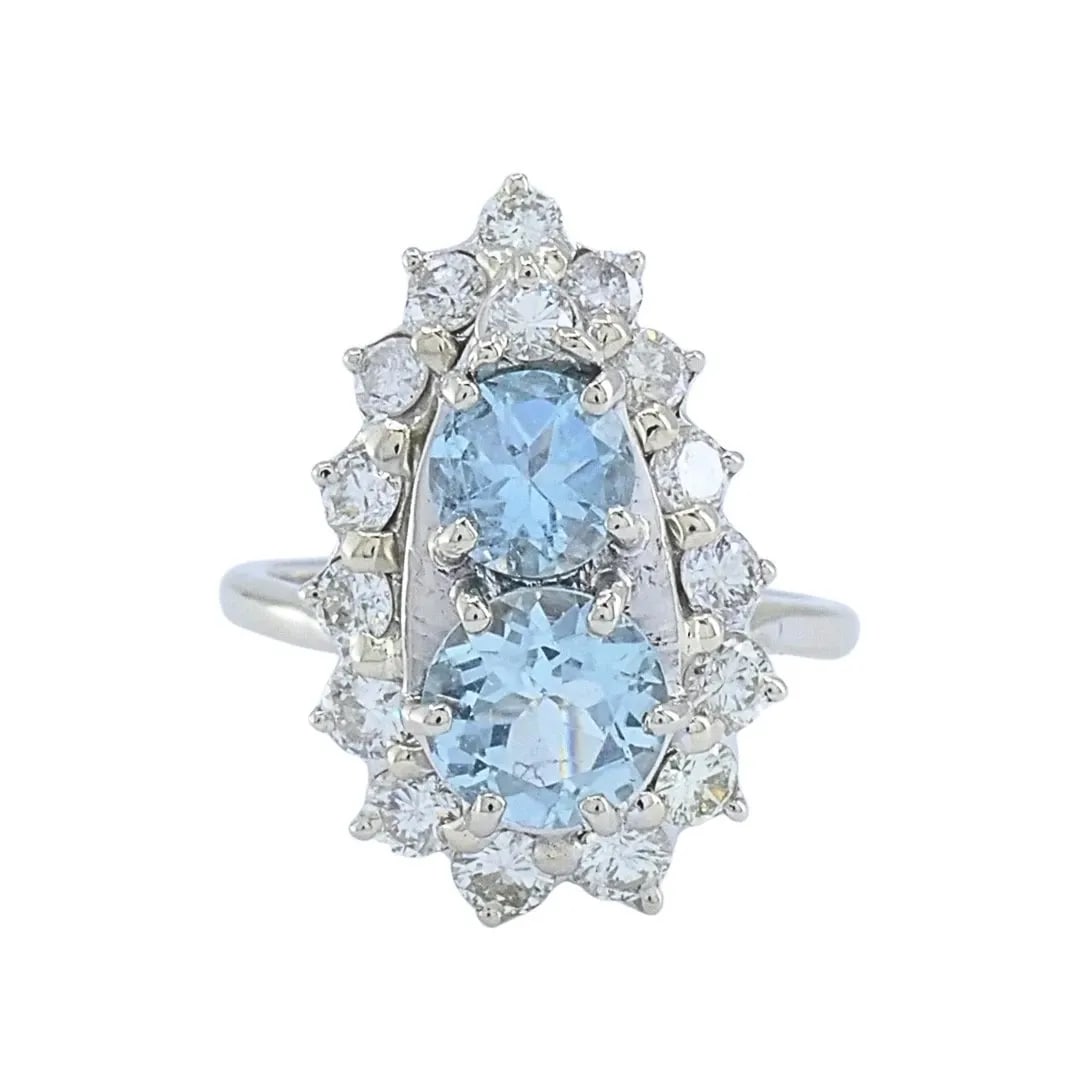 18K WHITE GOLD AQUAMARINE DIAMOND ELONGATED HALO RING: 18K WHITE GOLD AQUAMARINE DIAMOND ELONGATED HALO RING MATERIALS 18K Gold GEMSTONE Diamond, Aquamarine WEIGHT 4.5 Grams MEASUREMENTS Top - 7/16 x 3/4" RING SIZE 5.5 HALLMARKS 18K ITEM DETAILS 18k White