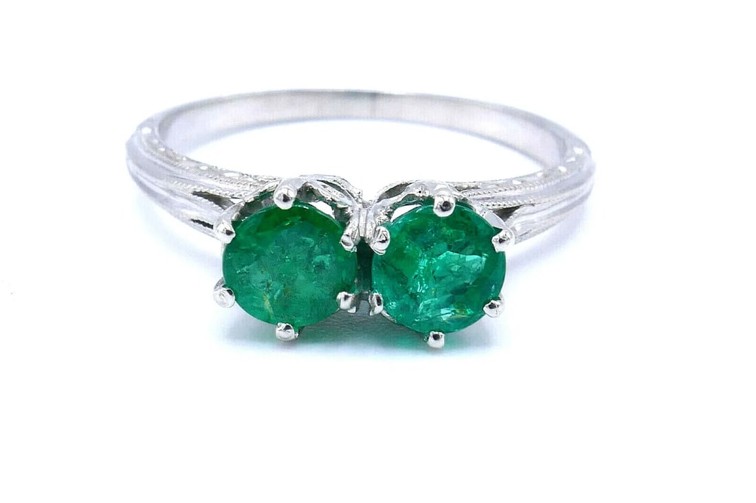 ANTIQUE PLATINUM EMERALD RING: ANTIQUE PLATINUM EMERALD RING Antique Platinum Emerald Ring Emeralds are ~0.6 pts in total Measurements: ring size is 5.75, 1/4" above the finger, height 3/16", the shank is 1/16". Weight is 3.2 grams
