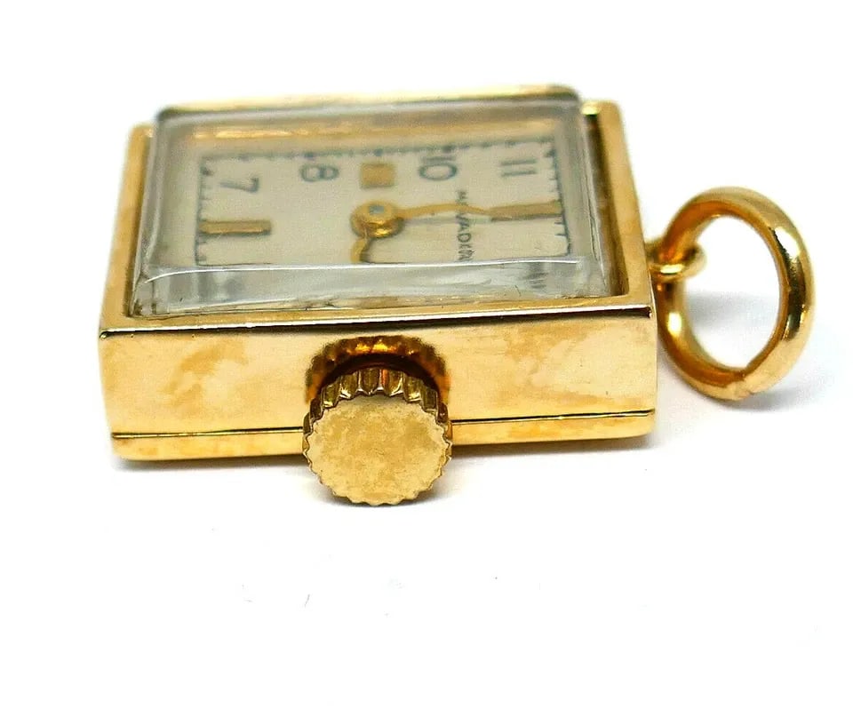 MOVADO VINTAGE WATCH PENDANT 10K YELLOW GOLD: MOVADO VINTAGE WATCH PENDANT 10K YELLOW GOLD 10k Yellow Gold Movado Vintage Watch Pendant Great pendant to add to your layering collection. If you are looking to buy it as a watch not just a pendant w