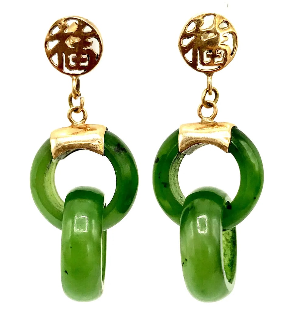 VINTAGE 14K YELLOW GOLD JADE EARRINGS: VINTAGE 14K YELLOW GOLD JADE EARRINGS Vintage 14k Yellow Gold Jade Earrings Two connected jade rings hanging on a 14k yellow gold stud fastening. Measurements: the ring diameter is 5/8", overall lengt