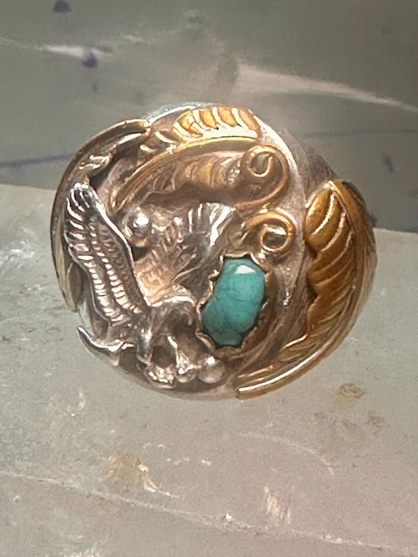 NAVAJO EAGLE RING TURQUOISE BAND SIZE 14.50 STERLING SILVER MEN WOMEN: NAVAJO EAGLE RING TURQUOISE BAND SIZE 14.50 STERLING SILVER MEN WOMEN Navajo Eagle ring turquoise band size 14.50 sterling silver men women Size. 14.50 Weight 20.1g Length 1" Width 7/8" Thinnest part 