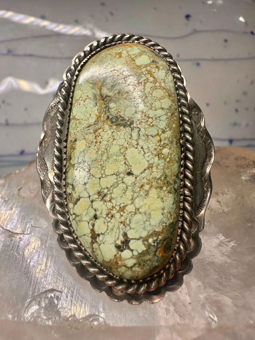 TURQUOISE RING SNAKES NAVAJO STERLING SILVER SIZE 9 WOMEN: TURQUOISE RING SNAKES NAVAJO STERLING SILVER SIZE 9 WOMEN Turquoise ring snakes Navajo sterling silver size 9 women The band is unmarked appears to be silver and the face appears to be bronze but unma