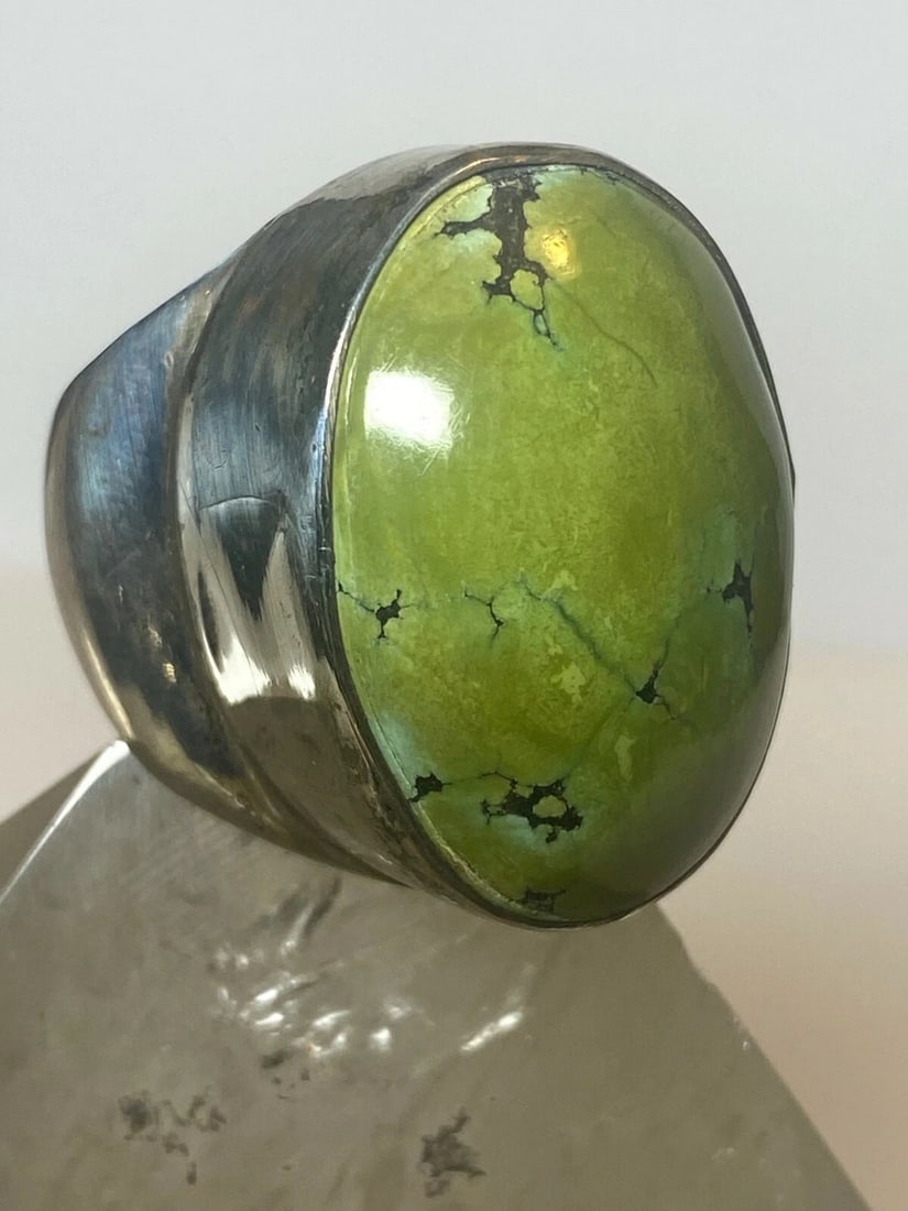 GREEN STONE RING STERLING SILVER WOMEN MEN SIZE 8.75: GREEN STONE RING STERLING SILVER WOMEN MEN SIZE 8.75 Green stone ring sterling silver women men AS IS A slight dent on the side of the setting not structural ..Stone is tight in place Size 8.75 Weight