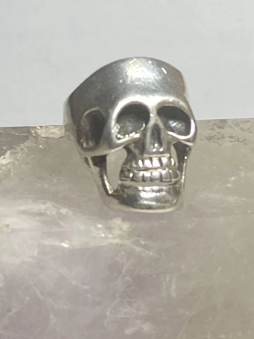 SKULL RING BIKER BAND STERLING SILVER BAND MEN WOMEN: SKULL RING BIKER BAND STERLING SILVER BAND MEN WOMEN Skull ring biker band sterling silver band men women Size 8.25 Between a size 8.25 and a size 8.50 Weight 12.3g Length 1" Width. 5/8" Thinnest part
