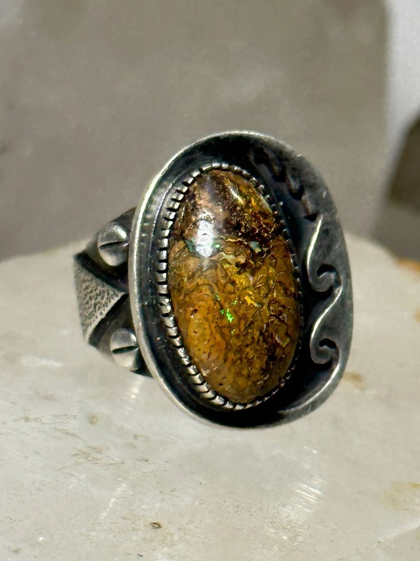 BOULDER OPAL NAVAJO RING SIZE 5.25 STERLING SILVER WOMEN: BOULDER OPAL NAVAJO RING SIZE 5.25 STERLING SILVER WOMEN Boulder Opal Southwestern ring size 5.25 sterling silver women Size 5.25 Weight 14.7g Length 7/8" Widest 3/4" Thinnest part. 1/4"