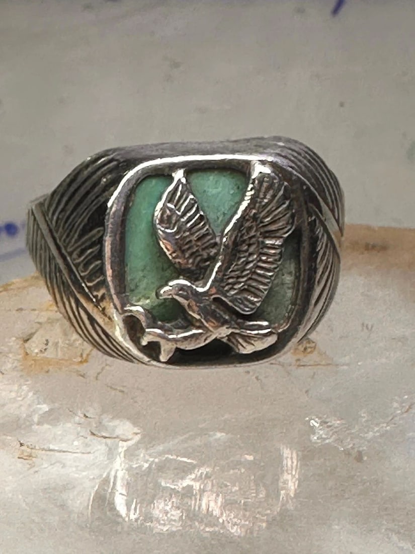 EAGLE RING SOUTHWEST TURQUOISE BAND SIZE 13.2 STERLING SILVER MEN WOMEN: EAGLE RING SOUTHWEST TURQUOISE BAND SIZE 13.2 STERLING SILVER MEN WOMEN Eagle Ring Wm Wheeler Turquoise band size 13.2 sterling silver men women Size 13.2 Weight 11.5g Length. 3/4" Width 1/2" Thinnest
