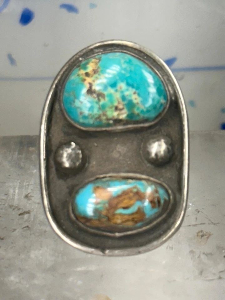 NAVAJO RING LONG TURQUOISE SIZE 5.75 STERLING SILVER WOMEN: NAVAJO RING LONG TURQUOISE SIZE 5.75 STERLING SILVER WOMEN Navajo ring Long Turquoise size 5.75 sterling silver women Size 5.75 Weight 11.7g Length 1 1/4" Width 3/4" Thinnest part of band in back 3/16