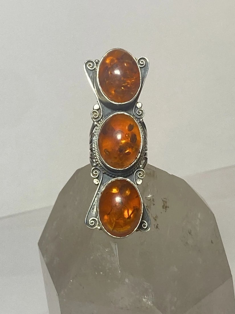 LONG AMBER RING SOUTHWEST STERLING SILVER BAND WOMEN: LONG AMBER RING SOUTHWEST STERLING SILVER BAND WOMEN long amber ring southwest sterling silver band women Size 7.25 Weight 31.7g Length 2. 1/2" Width 7/8" Thinnest part of band 3/16"