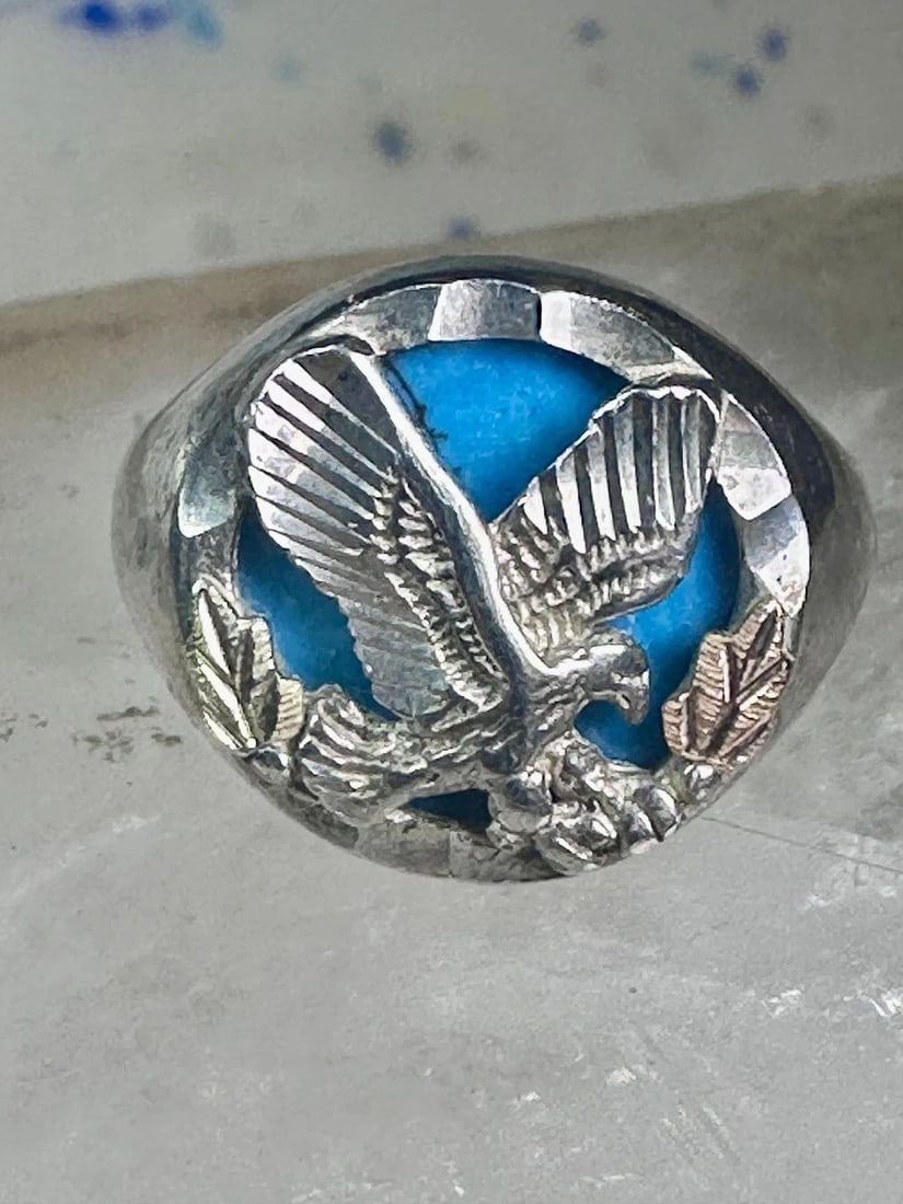 BLACK HILLS GOLD RING TURQUOISE EAGLE SIZE 7.25 STERLING SILVER WOMEN MEN: BLACK HILLS GOLD RING TURQUOISE EAGLE SIZE 7.25 STERLING SILVER WOMEN MEN Black Hills Gold ring turquoise Eagle Size 7.25 sterling silver women men Size 7.25 Weight 9.5g Length 5/8" Width. 5/8" Thinne