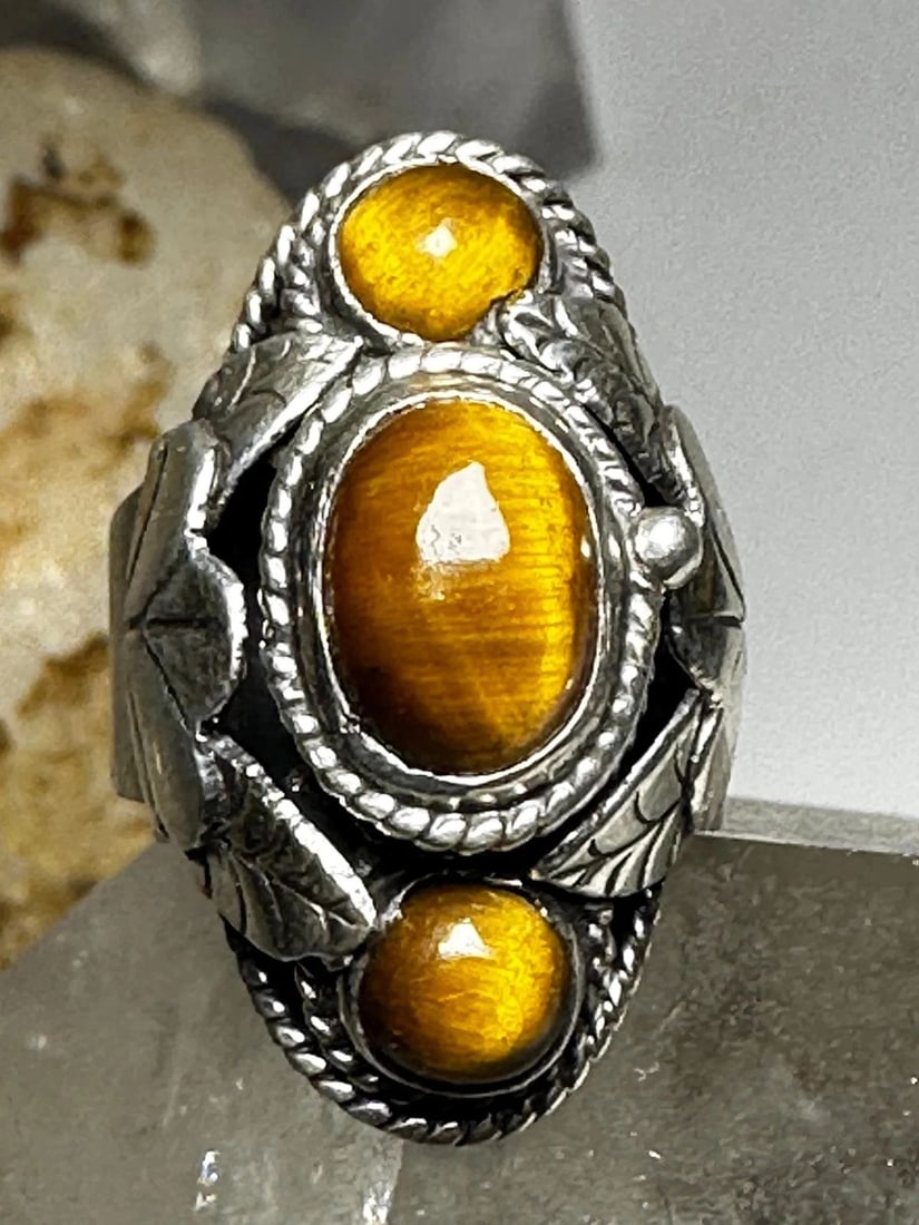 POISON RING TIGER EYE SIZE 6.50 ADJ MEXICO TAXCO STERLING SILVER WOMEN: POISON RING TIGER EYE SIZE 6.50 ADJ MEXICO TAXCO STERLING SILVER WOMEN Poison ring Tiger Eye size 6.50 adj Mexico Taxco sterling silver women Size 6.50 adj Weight. 9.2g Length 1" Width 1/2" Thinnest p