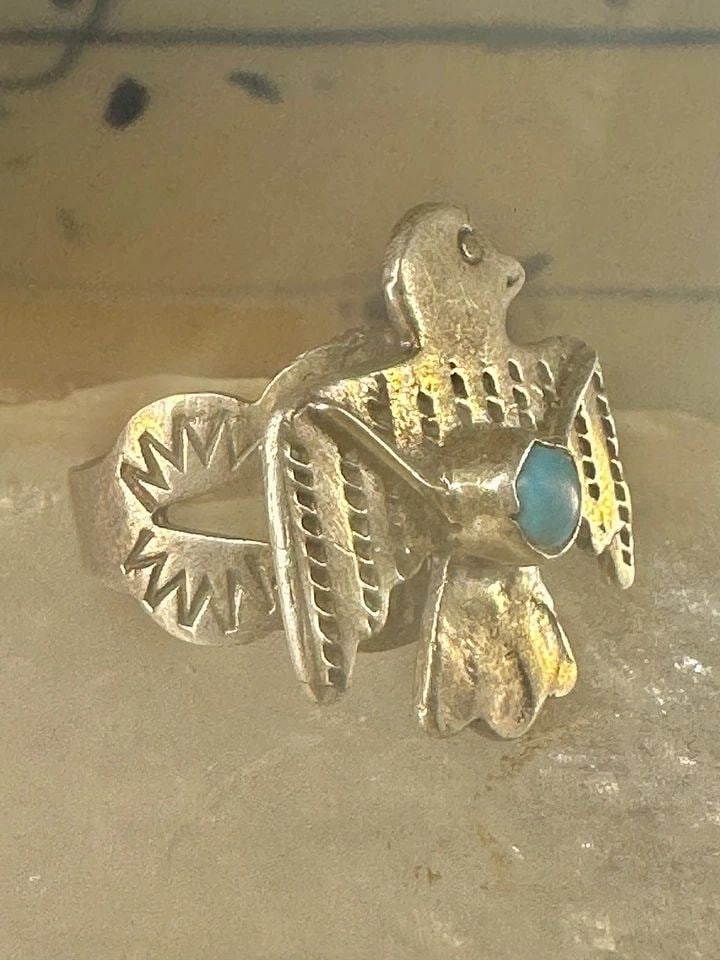 PHOENIX RING TURQUOISE BAND NAVAJO SIZE 5.75 STERLING SILVER WOMEN: PHOENIX RING TURQUOISE BAND NAVAJO SIZE 5.75 STERLING SILVER WOMEN Phoenix ring Turquoise band Navajo size 5.75 sterling silver women Size 5.75 Weight 5.7g Length 3/4" Width 13/16" Thinnest part od ba