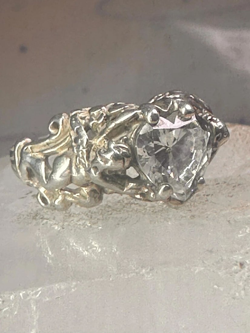 LOVE HEART RING CUPID VALENTINE BAND SIZE 7 STERLING SILVER WOMEN: LOVE HEART RING CUPID VALENTINE BAND SIZE 7 STERLING SILVER WOMEN Vintage Love Heart Ring Cupid Valentine band size 7 sterling silver women Size 7 Weight. 6.2g Width. 3/8" Thinnest part of band 1/8"