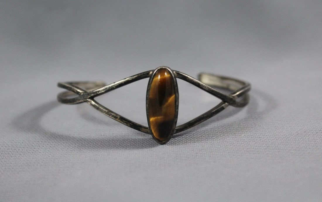 OLD PAWN NAVAJO STERLING SILVER WITH TIGERS EYE STONE BRACELET: OLD PAWN NAVAJO STERLING SILVER WITH TIGERS EYE STONE BRACELET Item Description: 1" Wide 5 1/2 " Inside with a 1 1/2 " Opening