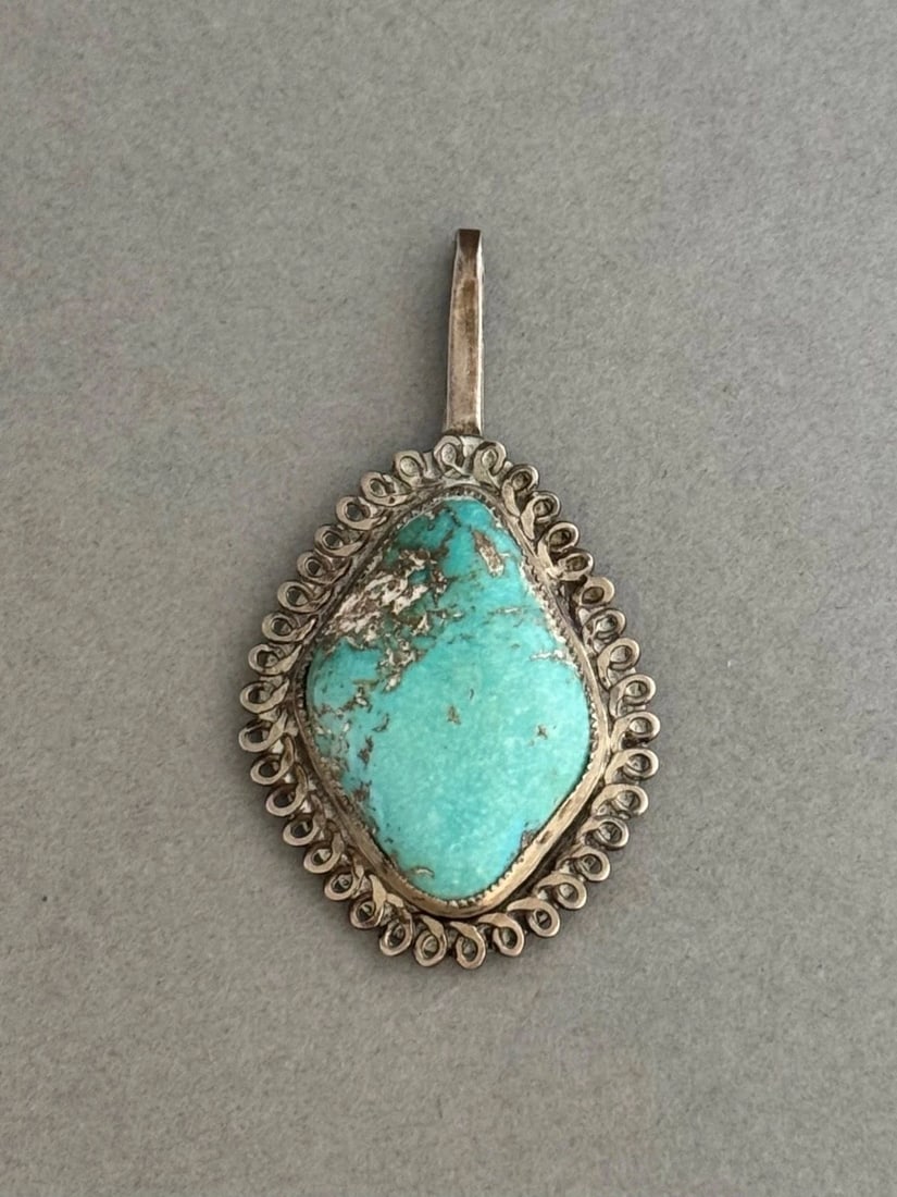 OLD PAWN NAVAJO STERLING SILVER AND TURQUOISE PENDANT: OLD PAWN NAVAJO STERLING SILVER AND TURQUOISE PENDANT Old Pawn Navajo Sterling Silver and Turquoise Pendant .. 1 7/8" Tall .. 1" Wide