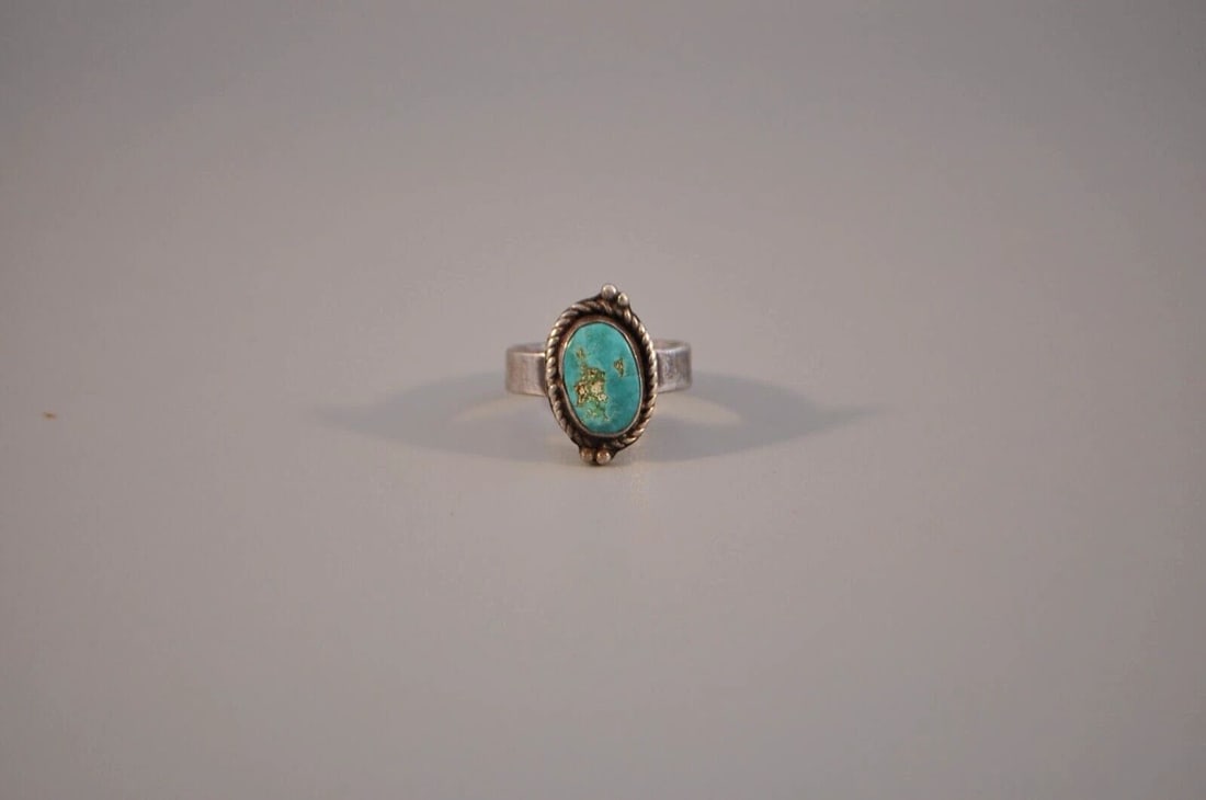 OLD PAWN NAVAJO STERLING SILVER RING - TURQUOISE SIZE 6: OLD PAWN NAVAJO STERLING SILVER RING - TURQUOISE SIZE 6 Weight 5.02 Grams 3/4" Tall Old Pawn Jewelry dates from the early 1900s to the 1970s. Most of it is not signed because it wasn't the Native Amer