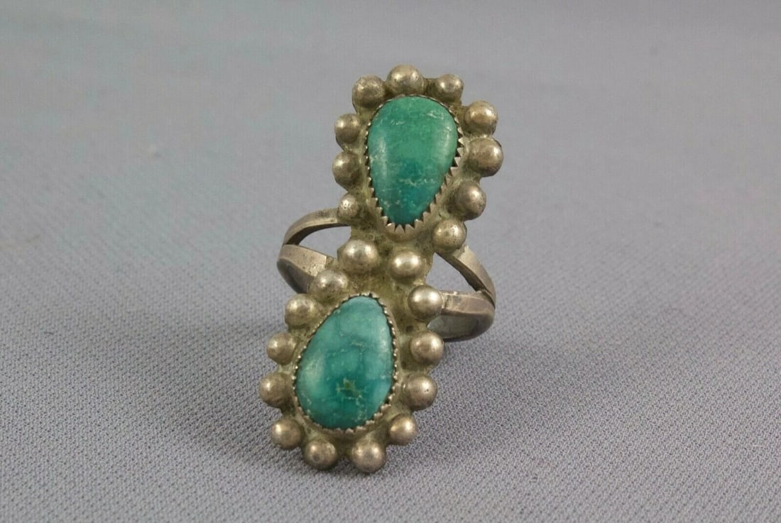 OLD PAWN VINTAGE NAVAJO INDIAN RING - 2 GREEN TURQUOISE STONES 1.5" TALL - 7.25: OLD PAWN VINTAGE NAVAJO INDIAN RING - 2 GREEN TURQUOISE STONES 1.5" TALL - 7.25 Item Description: This vintage Navajo silver ring came out of old pawn. It has 2 beautiful green turquoise stones surrou