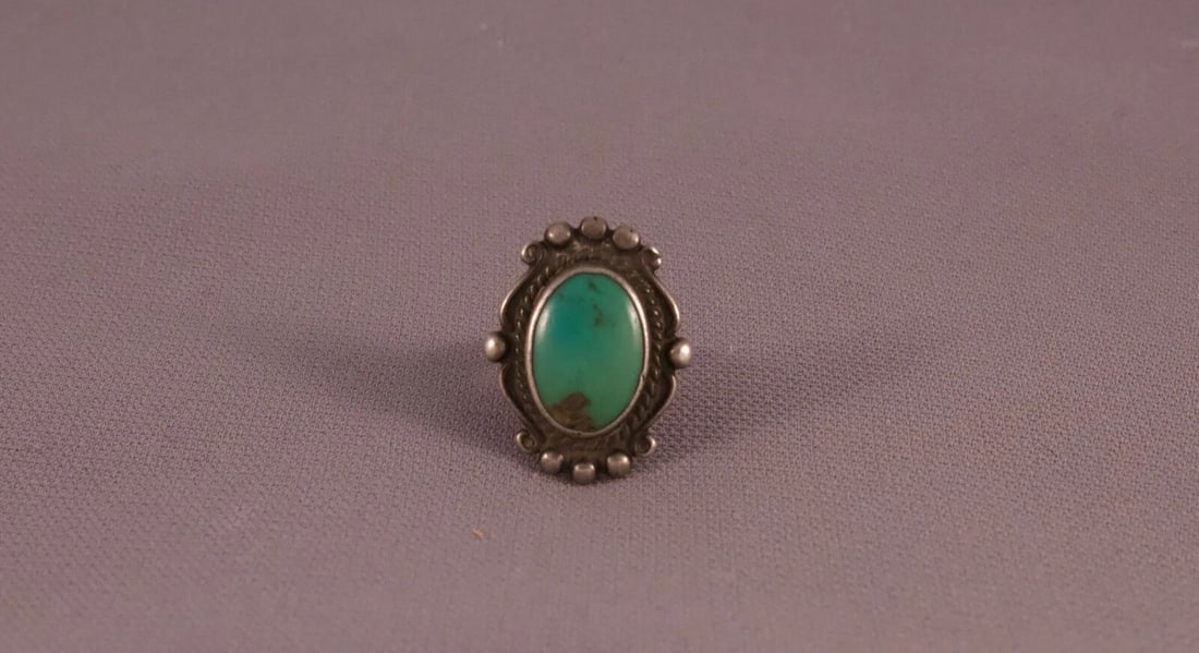 OLD PAWN NAVAJO STERLING SILVER AND TURQUOISE RING SIZE 4.75: OLD PAWN NAVAJO STERLING SILVER AND TURQUOISE RING SIZE 4.75 Item Description: 1" tall Old Pawn Vintage Navajo Indian Turquoise Ring. Great old turquoise ring with detailed silver work around stone.