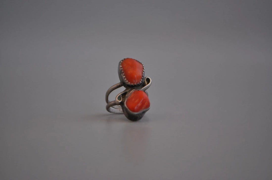 OLD PAWN NAVAJO STERLING SILVER RING CORAL SIZE 4: OLD PAWN NAVAJO STERLING SILVER RING CORAL SIZE 4 Weight 5.38 Grams 1" Tall Old Pawn Jewelry dates from the early 1900s to the 1970s. Most of it is not signed because it wasn't the Native American tra