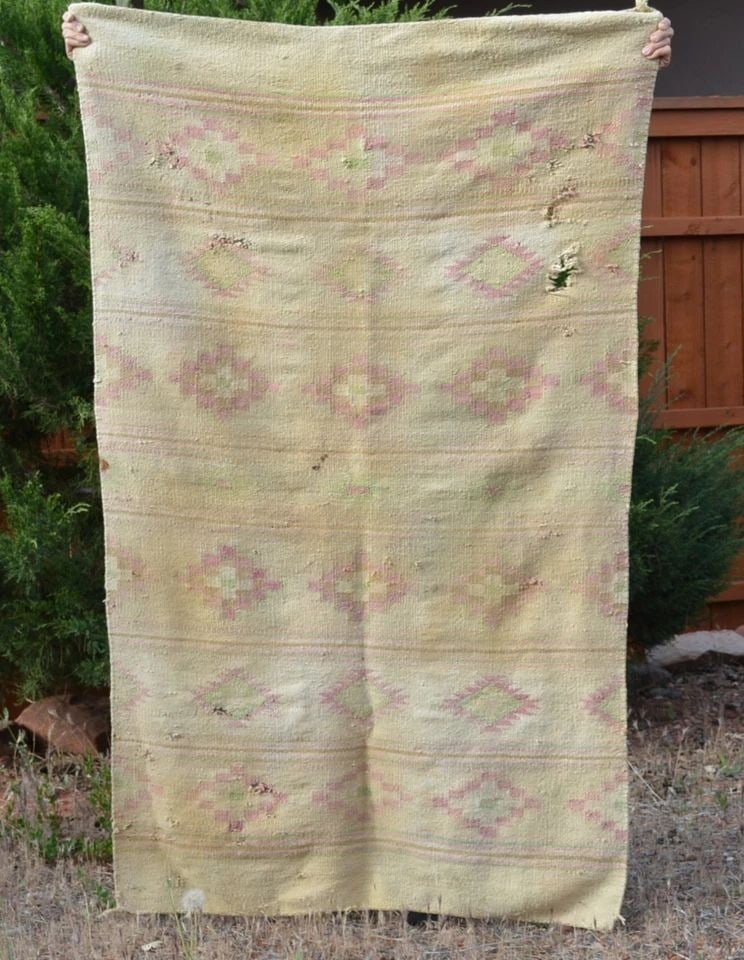 LARGE OLD CHINLE NAVAJO RUG - POOR CONDITION - 67" X 41": LARGE OLD CHINLE NAVAJO RUG - POOR CONDITION - 67" X 41" This old Chinle Navajo rug shows bands of serrated diamonds and crosses. It measures 67" x 41". It is in poor condition, there are holes, lots 