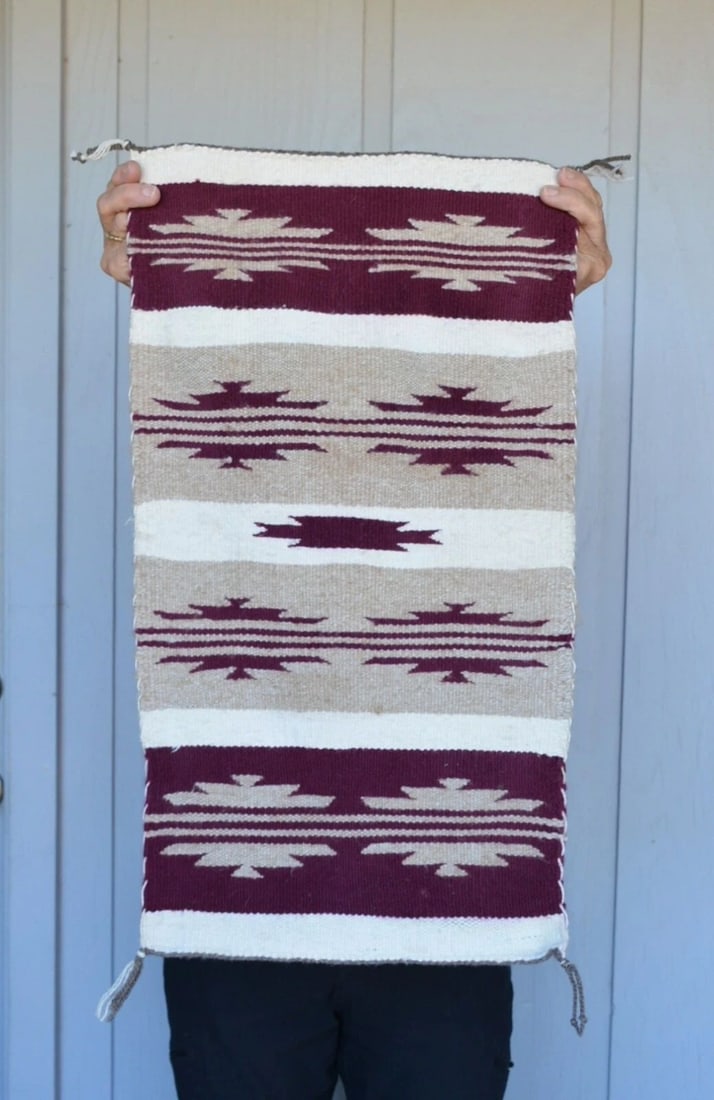 VINTAGE NAVAJO RUG - BANDED DESIGN - 25" X 13.5" WHITE TAN MAROON WOOLS: VINTAGE NAVAJO RUG - BANDED DESIGN - 25" X 13.5" WHITE TAN MAROON WOOLS This vintage Navajo rug has an attractive banded design in tan, white and maroon. It measures 25" x 13.5". It is in great condit