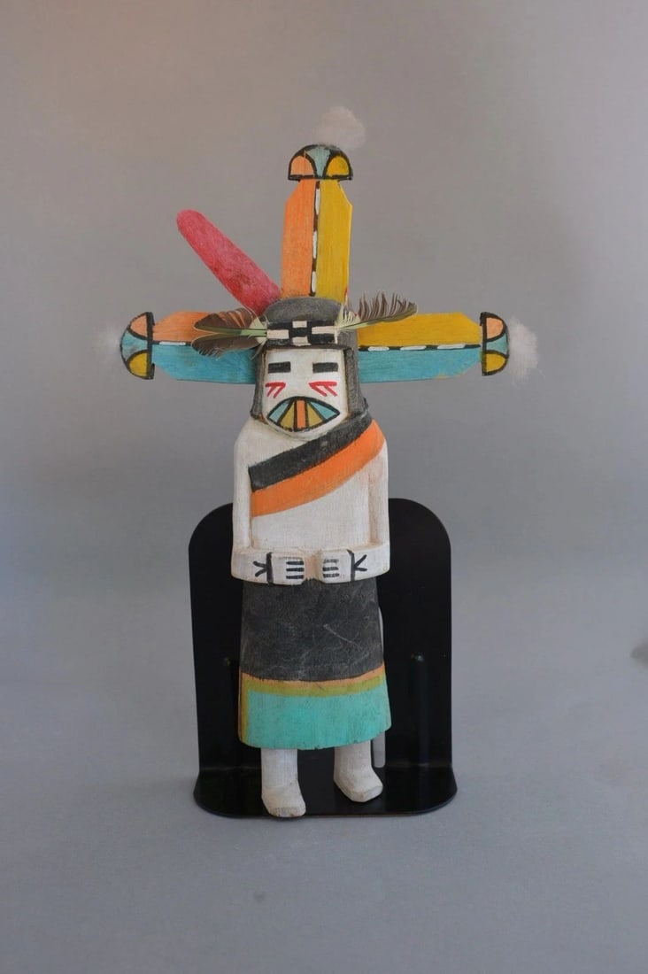 VINTAGE HOPI KACHINA - 11" TALL COTTONWOOD ROOT: VINTAGE HOPI KACHINA - 11" TALL COTTONWOOD ROOT Item Description: This vintage Hopi kachina is 11" tall, not including the feathers. It is missing one of the head pieces. Otherwise, it is in good vint
