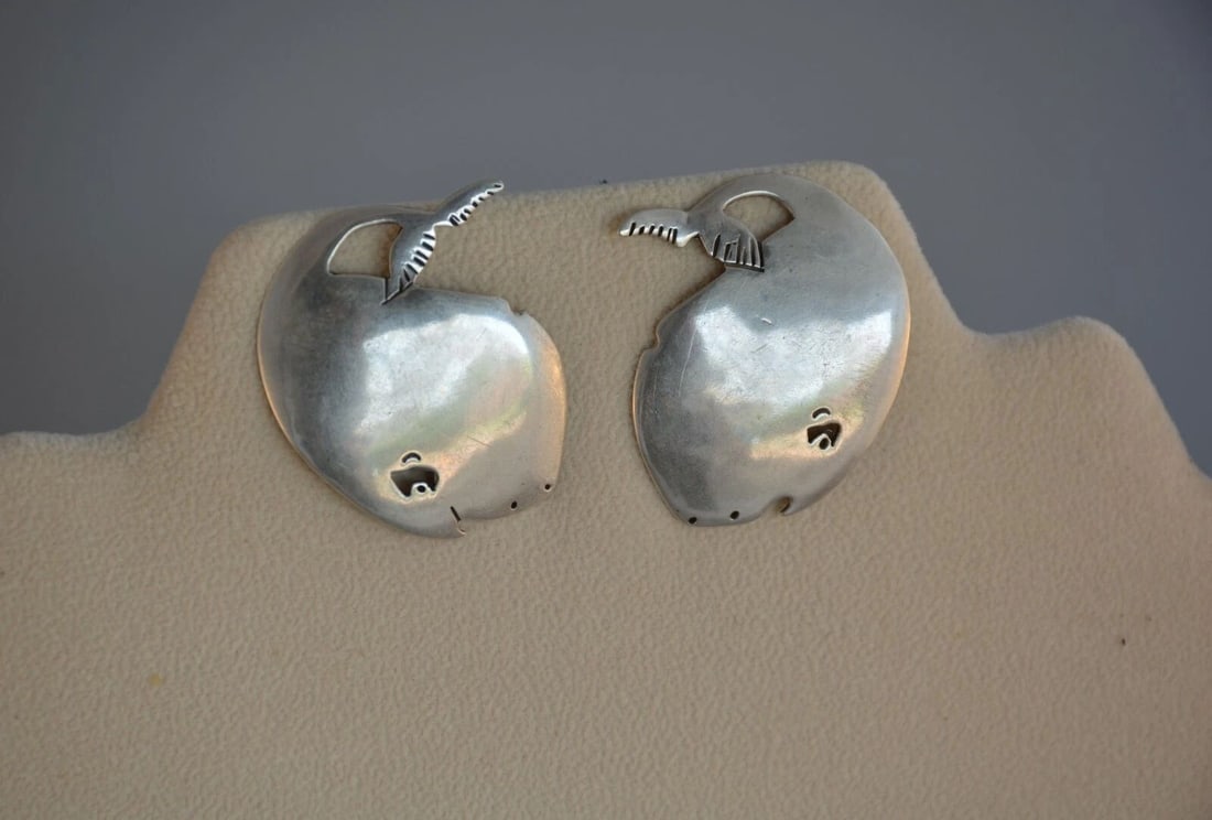 STERLING SILVER EARRINGS - DELIGHTFUL BABY WHALES FLIPPING TAILS - 1.5": STERLING SILVER EARRINGS - DELIGHTFUL BABY WHALES FLIPPING TAILS - 1.5" Item Description: This pair of sterling silver earrings bring a smile. Delightful baby whales - flipping their tails. They measu