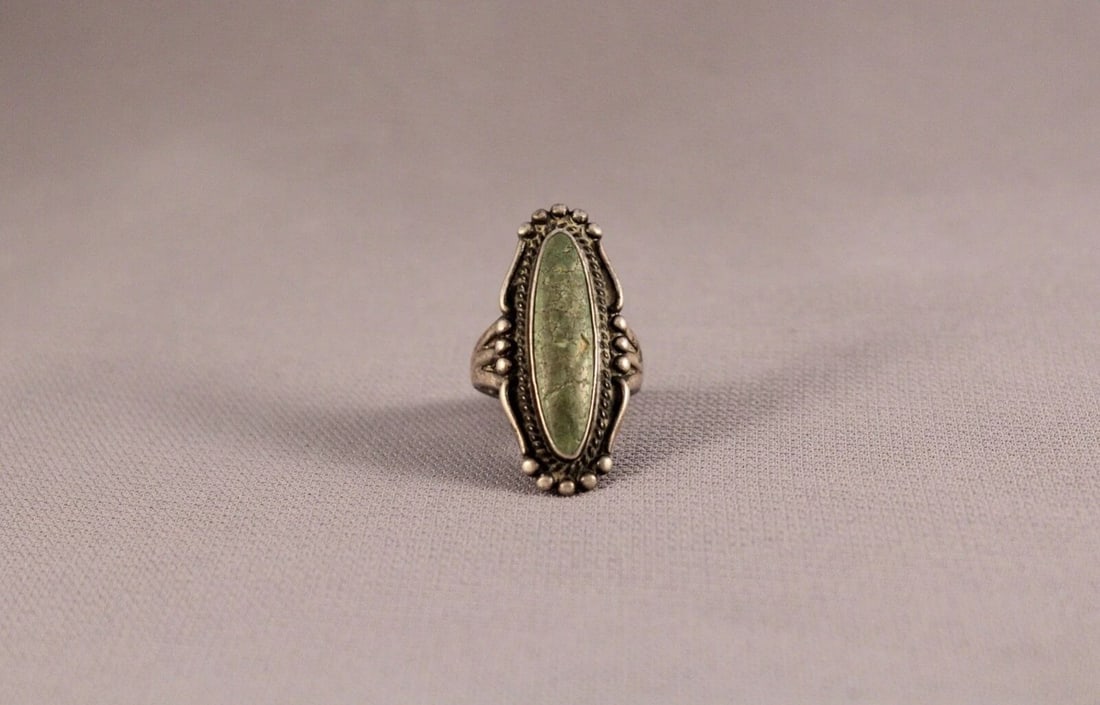 OLD PAWN NAVAJO STERLING SILVER AND TURQUOISE RING SIZE 4 3/4: OLD PAWN NAVAJO STERLING SILVER AND TURQUOISE RING SIZE 4 3/4 Item Description: 1 1/4" tall Turquoise has light Cracking But is secure in setting ..