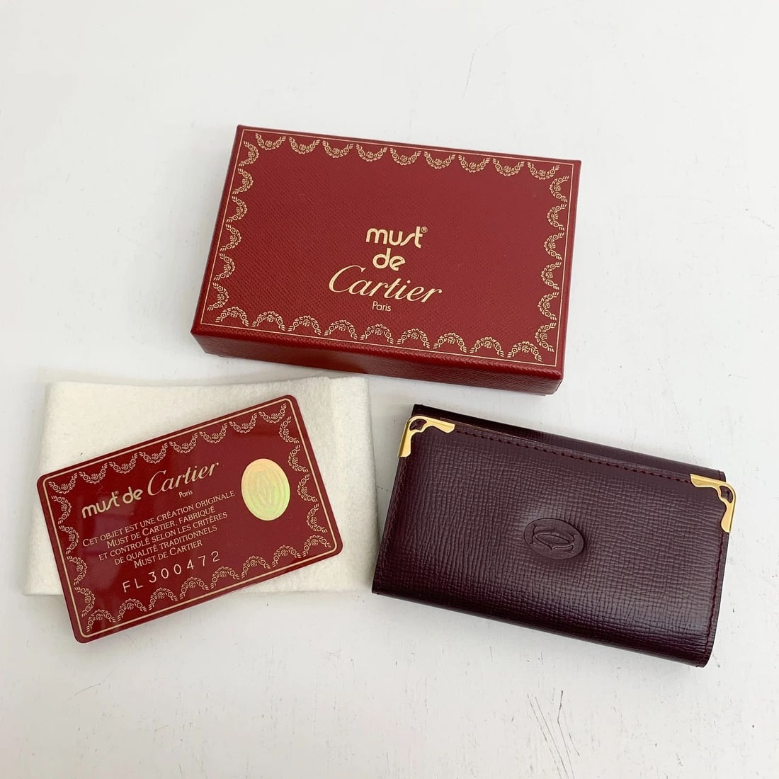 AUTHENTIC CARTIER BURGUNDY LEATHER KEY RING WALLET LOGO GP VINTAGE CARD HOLDER 3: AUTHENTIC CARTIER BURGUNDY LEATHER KEY RING WALLET LOGO GP VINTAGE CARD HOLDER 3 AUTHENTIC CARTIER BURGUNDY LEATHER KEY RING WALLET LOGO GP VINTAGE CARD HOLDER 3 Leather, Gold Plated Signature Emblem 