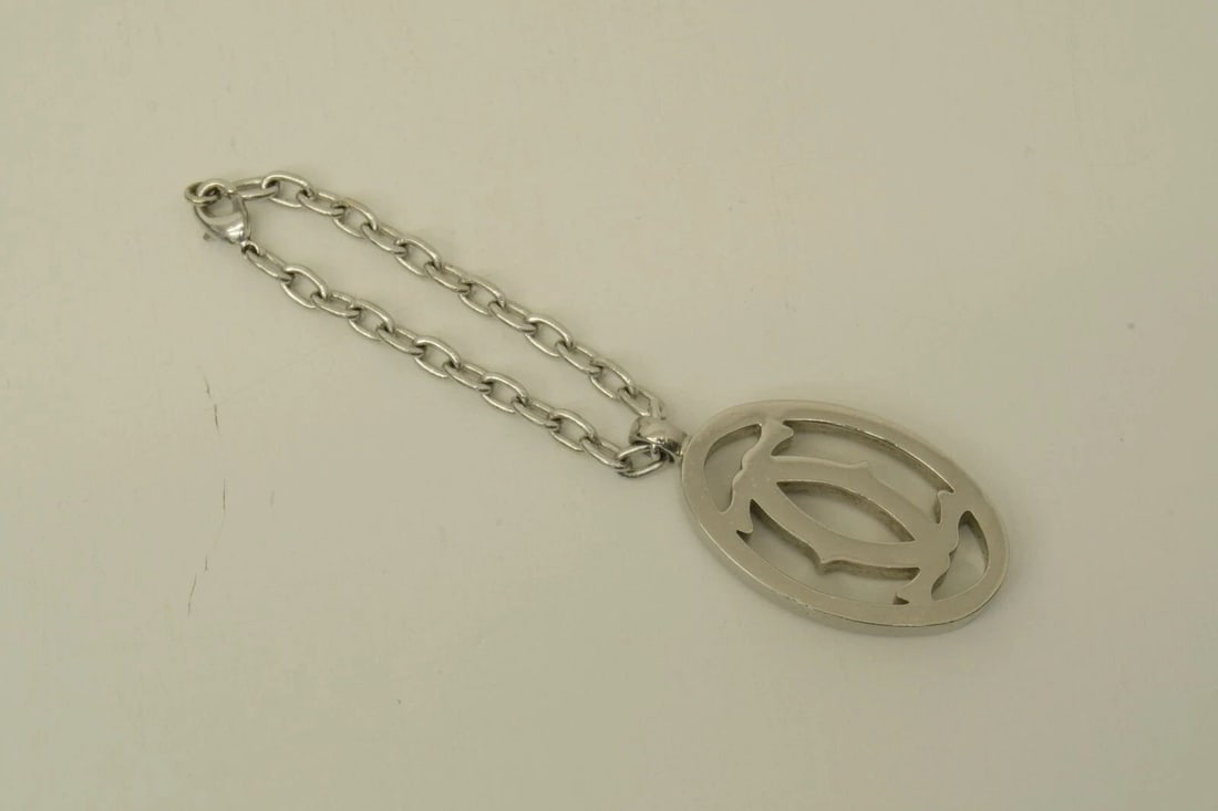 AUTHENTIC CARTIER DECOR LOGO CLASSIC SILVER KEYCHAIN SWISS MADE SIGNATURE CHARM: AUTHENTIC CARTIER DECOR LOGO CLASSIC SILVER KEYCHAIN SWISS MADE SIGNATURE CHARM Authentic Cartier Decor Logo Classic Silver Keychain Swiss Made Signature Charm Authentic Cartier Decor Logo Classic Sil