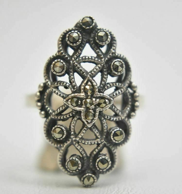LONG MARCASITES RING ART DECO STERLING SILVER SIZE 8.25: LONG MARCASITES RING ART DECO STERLING SILVER SIZE 8.25 Long Marcasite Ring Art Deco Sterling Silver Size 8.25 Weight 4.7g Widest Part of Band 1" Thinnest Part of Band 3/32"