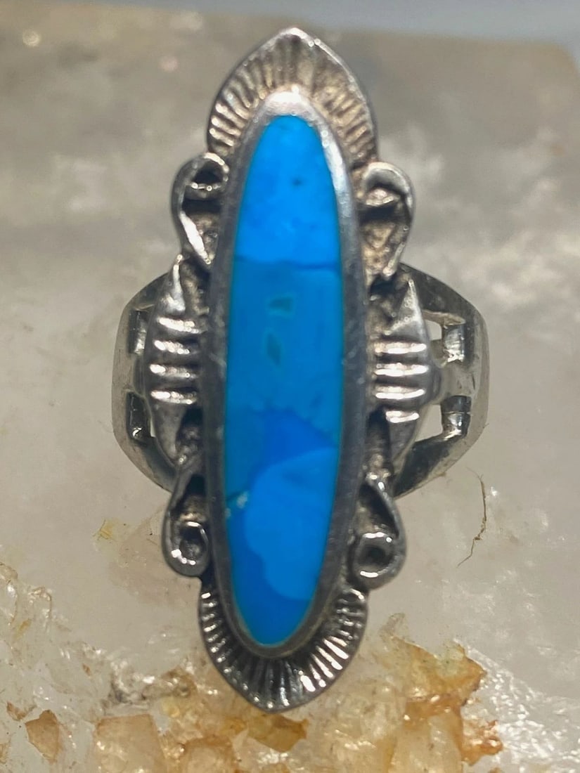 TURQUOISE RING SOUTHWEST STERLING SILVER WOMEN GIRLS: TURQUOISE RING SOUTHWEST STERLING SILVER WOMEN GIRLS Long Turquoise ring southwest sterling silver women girls Size 6.75 Weight. 9.5g Length. 1 1/4" Width. 1/2" Thinnest part 1/8"