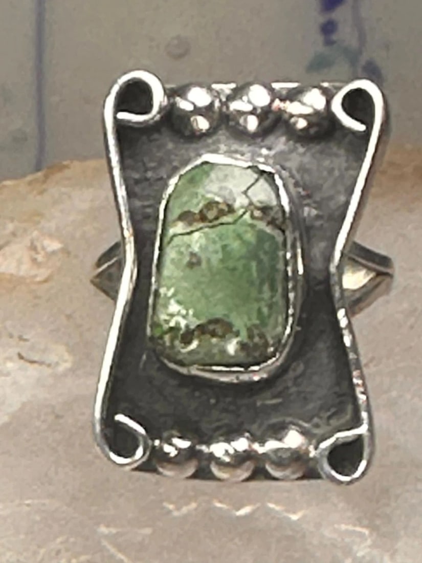 TURQUOISE NAVAJO SIZE 7.25 STERLING SILVER WOMEN: TURQUOISE NAVAJO SIZE 7.25 STERLING SILVER WOMEN Turquoise Navajo size 7.25 sterling silver women Size 7.25 Weight. 6g Length 1” Width 3/4” Band in Back. 1/8"