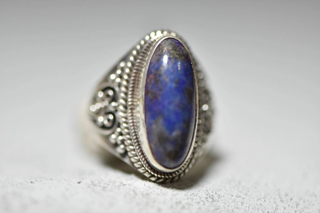 LAPIS LAZULI RING LONG WOMEN STERLING SILVER: LAPIS LAZULI RING LONG WOMEN STERLING SILVER Lapis Lazuli ring long women sterling silver Size 7.25 Weight 10.1g Length of the ring 1 3/8" Width of the ring 3/8" Thinnest part of band
