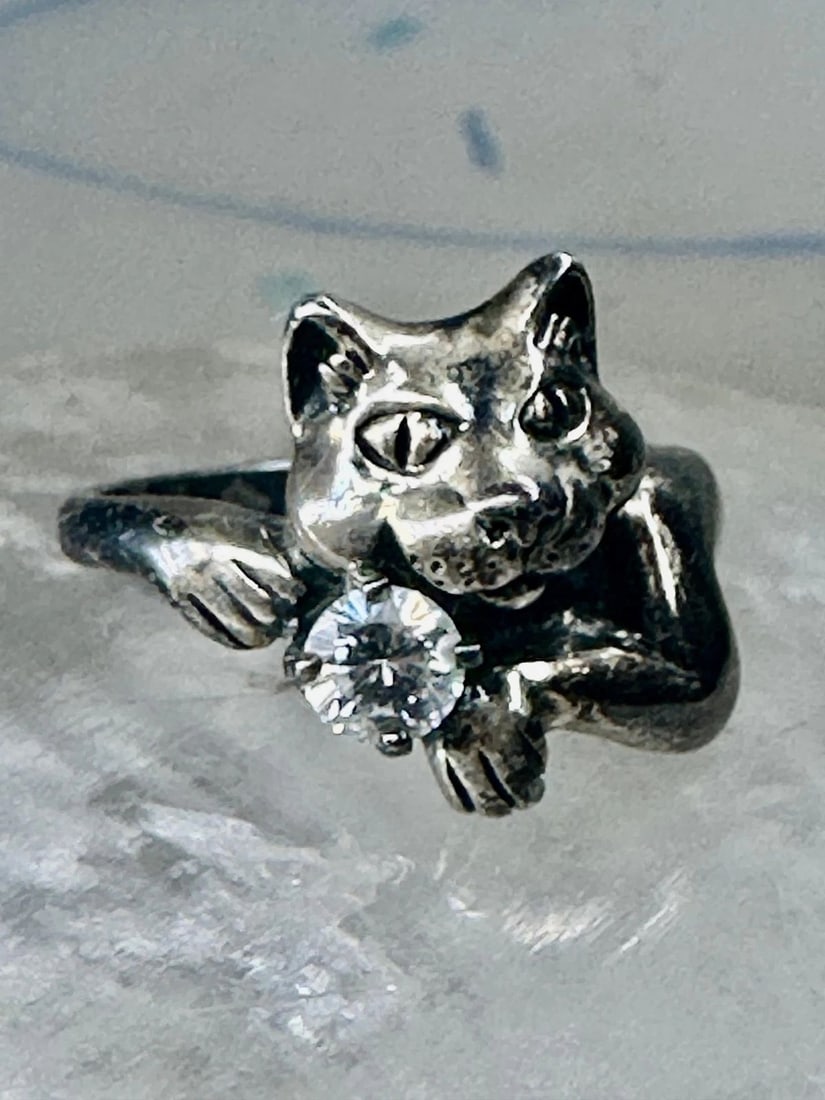 SMILING CAT RING CRYSTAL CZ KBN KABANA BAND SIZE 5 STERLING SILVER WOMEN GIRLS: SMILING CAT RING CRYSTAL CZ KBN KABANA BAND SIZE 5 STERLING SILVER WOMEN GIRLS Smiling Cat ring crystal CZ KBN Kabana band size 5 sterling silver women girls Size 5 Weight 4.1g Length 1/2" Width 3/8" 